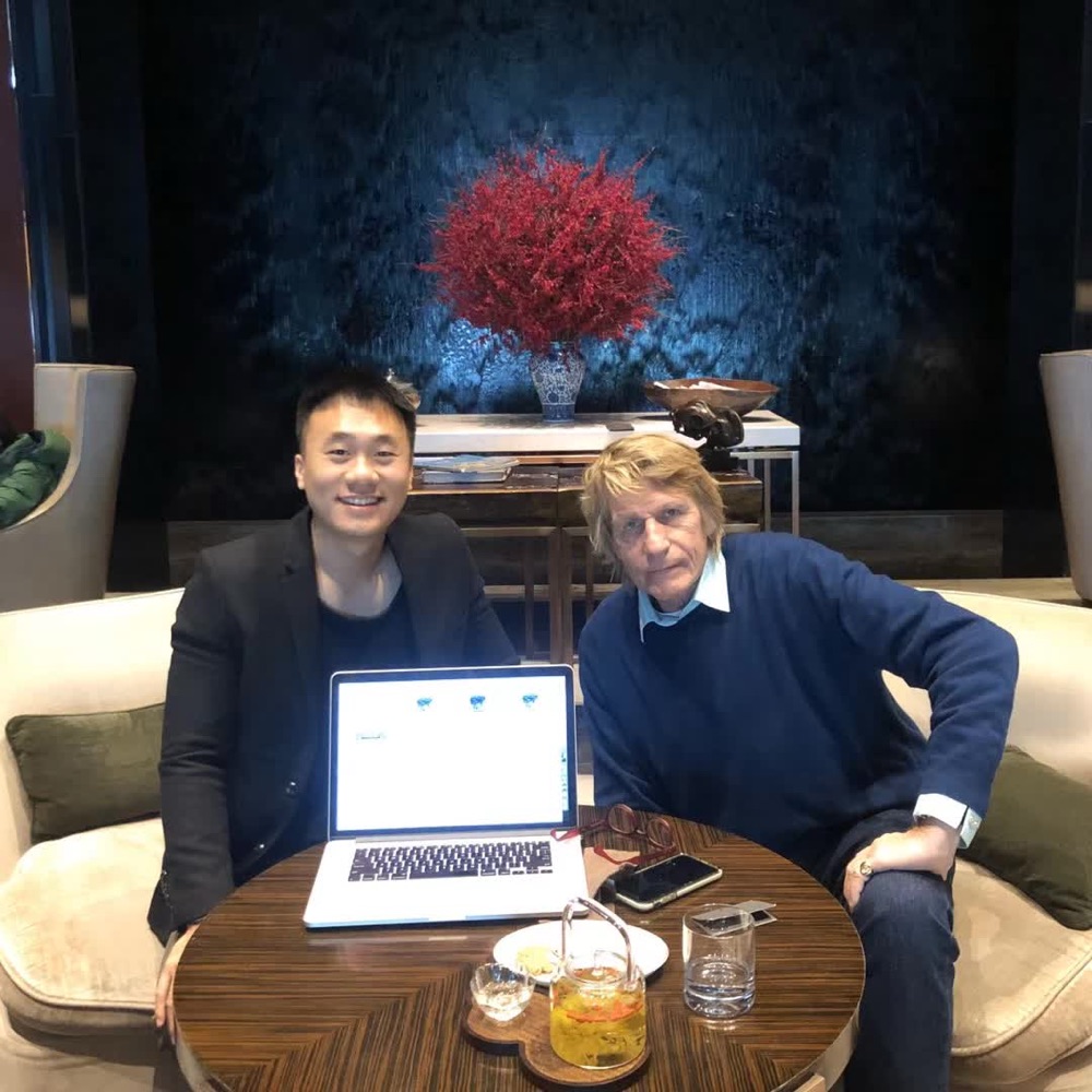 Derek and Jeremy over tea at the New World Beijing Hotel, the product open on a laptop