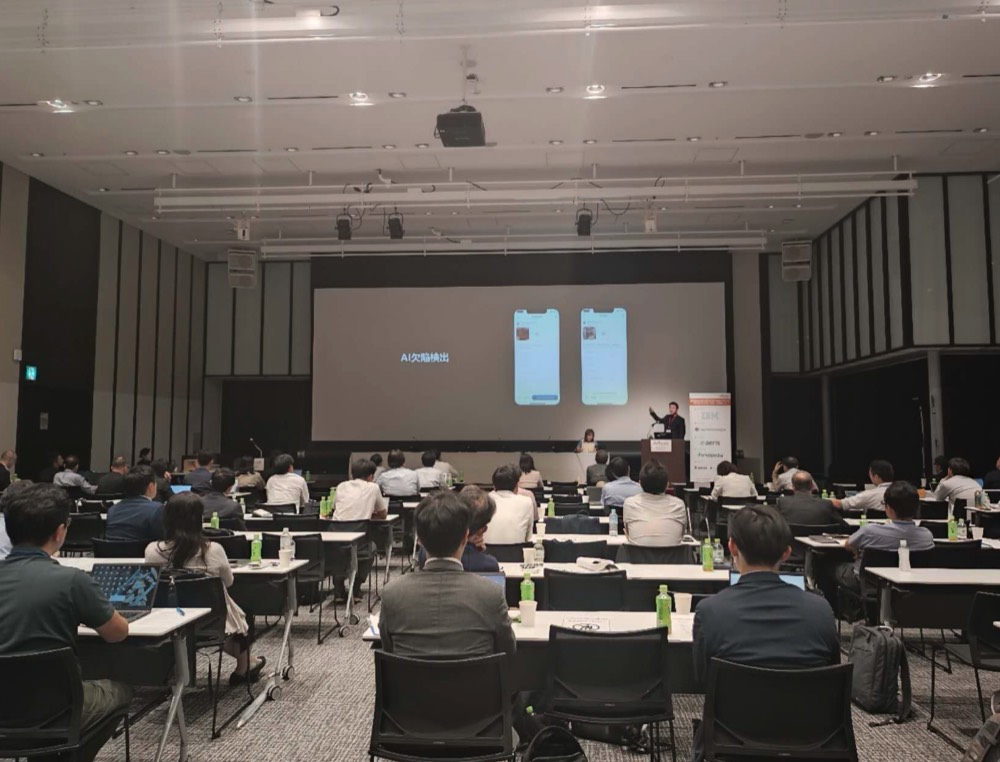Derek speaking, the inspection-report app shown on the projector screen, ReVision Summit Tokyo